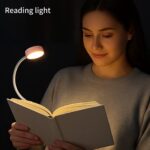 woman reading book using soft LED reading lamp